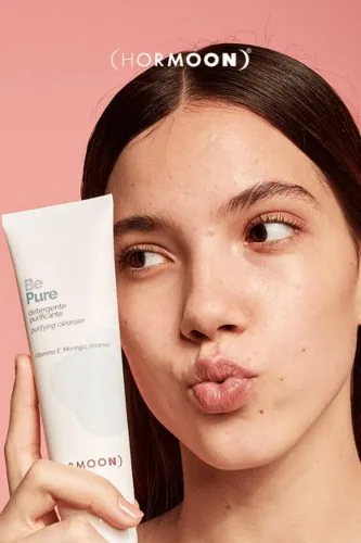 Girl holding a tube of face cleanser, Hormoon campaign, skincare