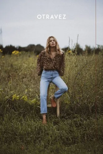 Model in a leopard-print shirt and jeans in a meadow, Otravez campaign, women’s fashion